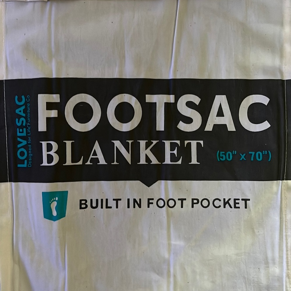 Never used tags on Lovesac footsac blanket